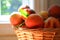 Peaches up close a basket of peaches by a kitchen window