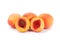 Peaches whole and cutted in halves on a white background isolated close up