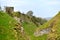 Peak District UK, old historic Peveril Castle, climb