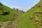 Peak District UK, old historic Peveril Castle, climb