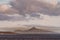 Peak on island of Wollaston archipelago under cloudscape, Cape Horn, Chile