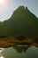 The Peak of Midi d`Ossau is reflected in the lake of Gentau, natural park of the Midi dOssau.