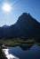 The Peak of Midi d`Ossau is reflected in the lake of Gentau, natural park of the Midi dOssau