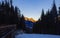 The peak of the mountains of the dolomites during sunset. High mountain landscape of the Dolomites in winter. Fantastic orange