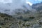 peak of Rysy mountain covered in mist. autumn ascent on hiking t