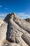 The peak of a unique, textured white rock formation in the Vermillion Cliffs National Monument