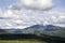 Peak with Utah Snow capped mountains with rolling green hills