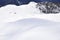 The peaks of the Alps in winter with soft snow