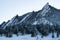 Peaks of the boulder flatirons with snow during winter in colorado