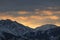 Peaks and slopes of the high snow-capped mountains of the Trans-Ili Alatau during early sunrise on an early winter morning