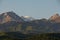 Peaks and slopes of the mountains of the Zailiysky Alatau during the summer morning sunrise.