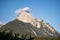 peaks of the wetterstein mountains in the clouds in the early morning, view from mittenwald town