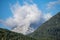 peaks of the wetterstein mountains in the clouds in the early morning, view from mittenwald town