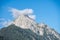 peaks of the wetterstein mountains in the clouds in the early morning, view from mittenwald town