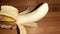 pealed banana  on brown background closeup image
