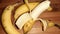 pealed banana  on brown background closeup image