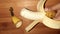 pealed banana  on brown background closeup image