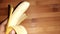 pealed banana isolated on brown background closeup image