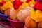 Pealed coconuts, lotus , rose and other flowers prepared for pooja, ritual worship in a temple