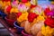 Pealed coconuts, lotus , rose and other flowers prepared for pooja, ritual worship in a temple