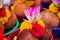 Pealed coconuts, lotus , rose and other flowers prepared for pooja, ritual worship in a temple