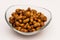 Pealed hazelnuts in the glass bowl