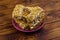 Peanut brittles in plate on wooden table