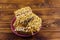 Peanut brittles in plate on wooden table