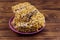 Peanut brittles in plate on wooden table