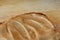 Peanut butter and bread on wooden chopping board