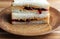 Peanut butter and jelly sandwich on white bread, cut in half and stacked. Close up view.