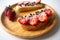 Peanut butter spread toasts with chocolate chips, strawberries, coconut flakes and homemade bread