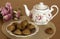 Peanut cookies, Teapot and flowers on the table