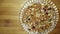 Peanut and jaggery winter sweet on plate isolated on wooden background