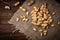 Peanut in the shell in wooden bowl on dark wooden background