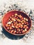 Peanut snack in wooden bowl.