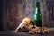 Peanuts and beer on wood background