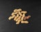 Peanuts on Black, Roasted Arachis Nuts Pile, Open Pea Nut, Whole Groundnut with Shell, Macro Peanut