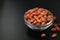 Peanuts Isoalted on Black Board. Fried Nuts, Peanuts in glass Bowl.