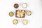 Peanuts, melon seeds, raisins, cashews and walnuts are in a hexagonal shape on a white background