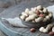 Peanuts in the shell and peeled close up in a cup. Background with peanuts. Roasted peanuts in the shell and peeled on a backgroun