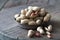 Peanuts in the shell and peeled close up in a cup. Background with peanuts. Roasted peanuts in the shell and peeled on a backgroun