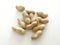 Peanuts in shells on white background Organic dried fruits for a healthy diet and ideal for peanut butter. Aerial view