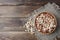 peanuts on wooden background. Unpeeled, peeled and salted peanuts