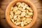 Peanuts in a wooden bowl