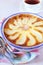 Pear clafoutis and cup of tea, french cuisine