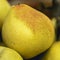 Pear close-up yellow color with a blushing side Autumn collection basket filled with pears, leaves