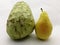 Pear and ripe banana on white backg round