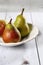 Pear white plate and wooden table