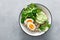 Pearl barley bowl with soft-boiled egg and corn salad